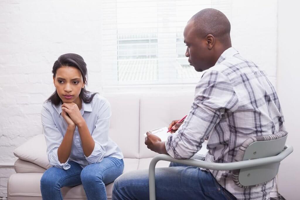 Woman and her therapist discuss a relapse prevention plan
