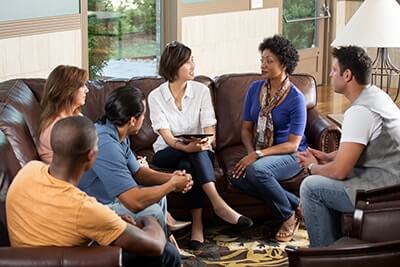 People sharing during a group therapy program