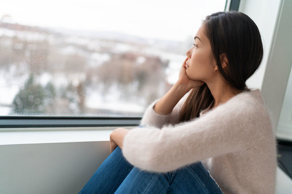 Woman looking out window wonders what is methadone and can it help her?