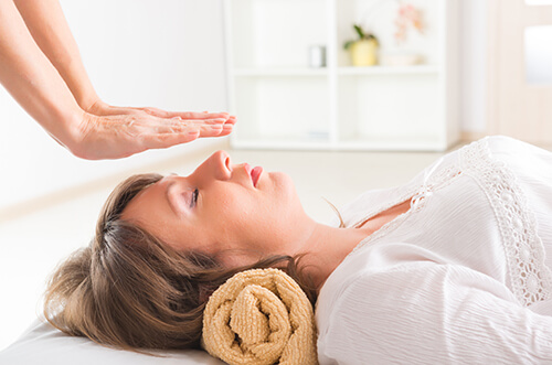 Woman undergoing a holistic therapy treatment