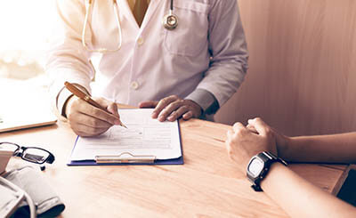 Doctor going over the options at a substance abuse treatment center in Palm Springs, CA