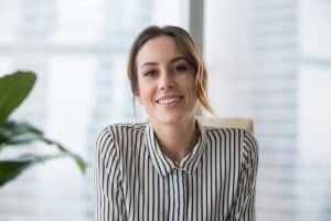 A woman smiles as she thinks about a Women's Rehab Program