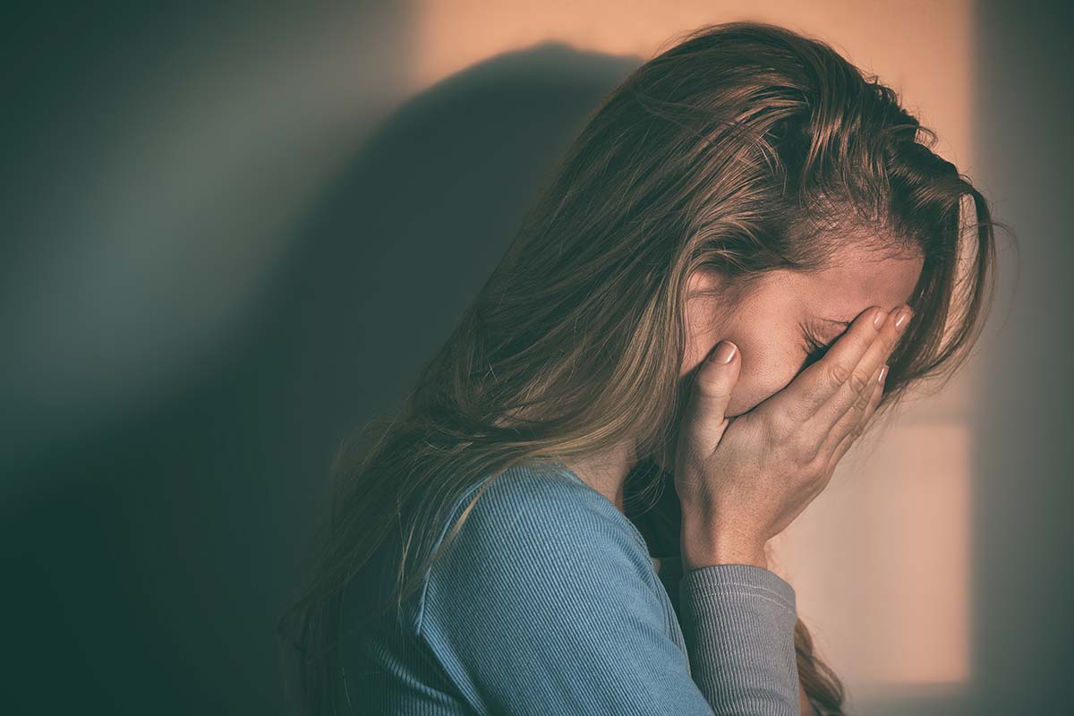 a young girl crying about Types of Addiction