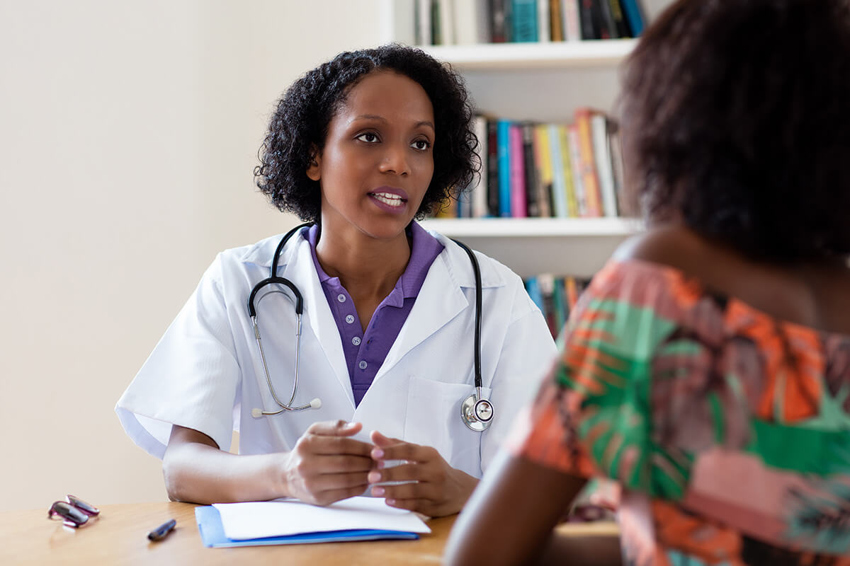 doctor talking to patient about medication assisted treatment for opioid addiction