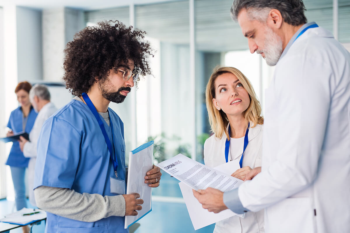 doctor talking with nurses understanding the opioid crisis