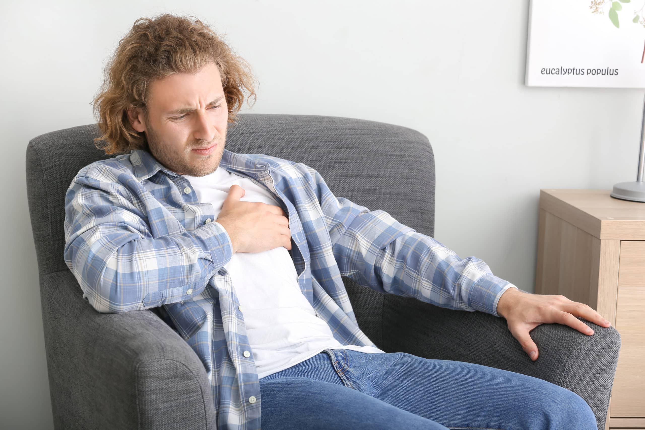 Man experiencing chest pain immediately after drinking alcohol