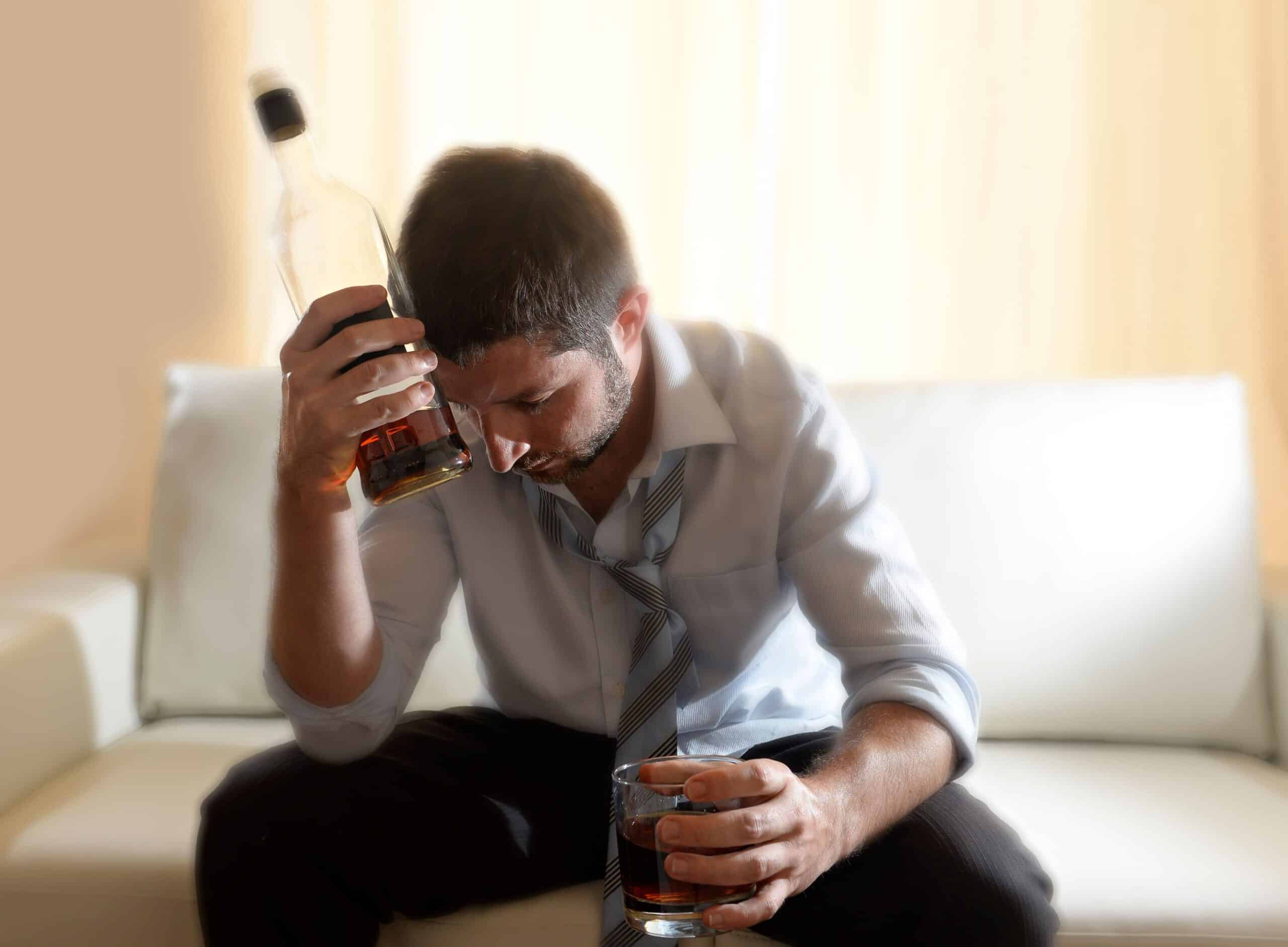 Man struggling with alcohol shakes